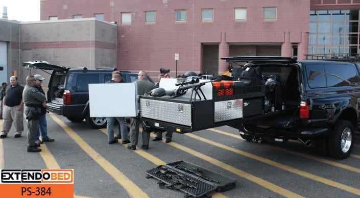 Extendobed SWAT slideout with SWAT standing around